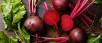 Fresh beets on farm table.
